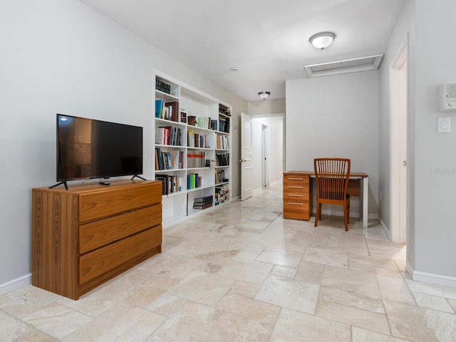 sitting room featuring built in shelves