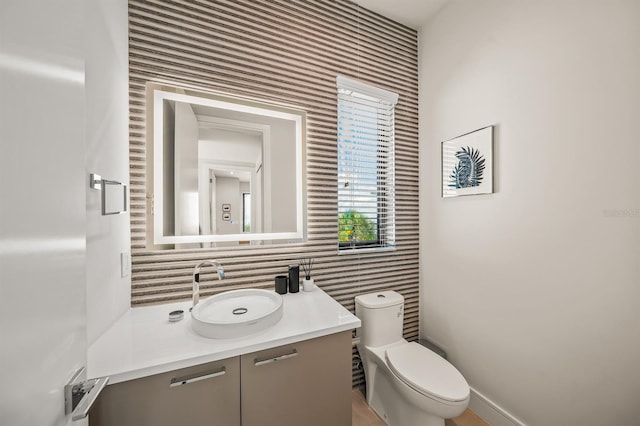 bathroom with vanity and toilet