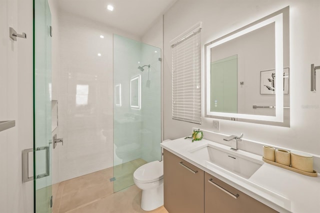 bathroom with vanity, toilet, and walk in shower