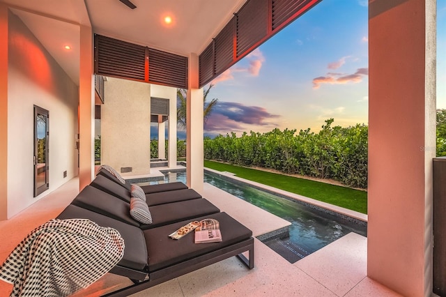 view of patio terrace at dusk