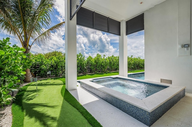 view of pool with an in ground hot tub