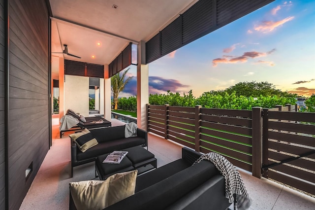 patio terrace at dusk with an outdoor living space