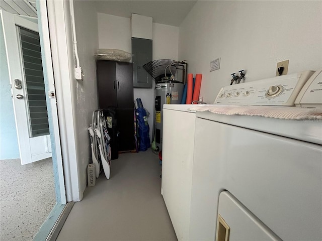 washroom with washing machine and dryer, electric panel, and water heater