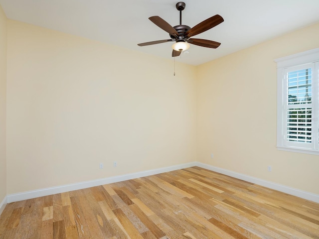 empty room featuring light hardwood / wood-style flooring and ceiling fan