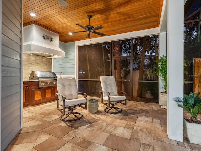 view of patio / terrace with area for grilling, a grill, and ceiling fan