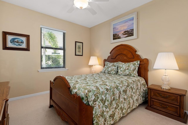 bedroom featuring ceiling fan and light carpet