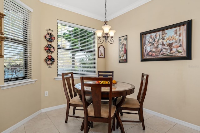 dining space with light tile patterned floors, an inviting chandelier, and a wealth of natural light