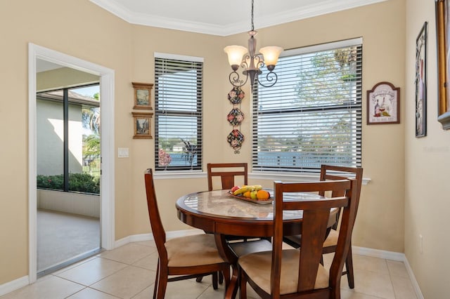 dining space featuring a chandelier, light tile patterned floors, and ornamental molding