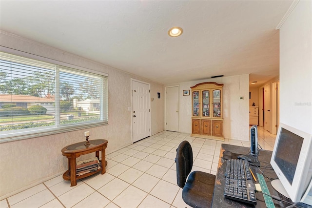 office space with light tile patterned flooring and ornamental molding