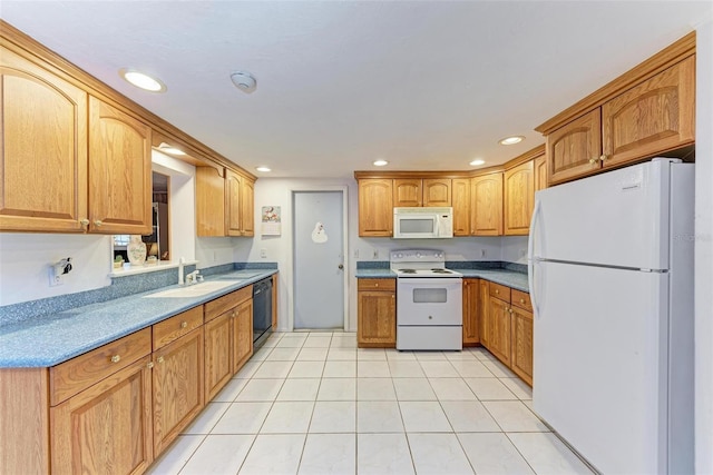 kitchen featuring white appliances, sink, and light tile patterned floors