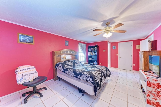 tiled bedroom featuring a textured ceiling, ceiling fan, and crown molding