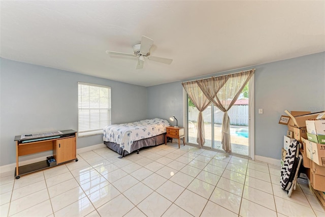 tiled bedroom with access to exterior, multiple windows, and ceiling fan