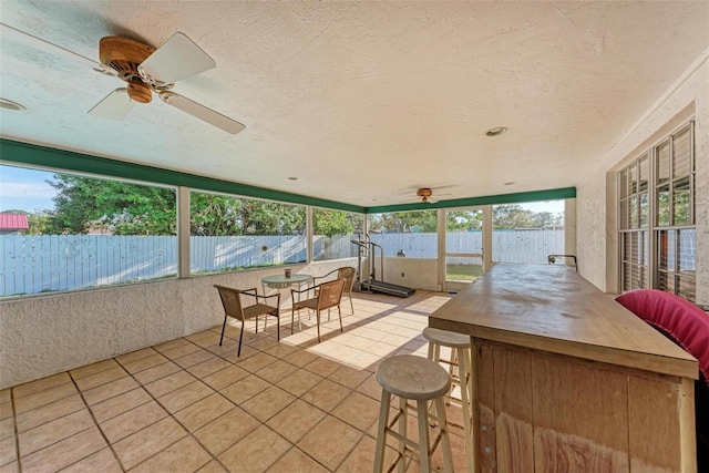 sunroom / solarium with ceiling fan