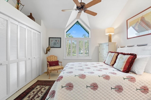 bedroom featuring carpet, ceiling fan, lofted ceiling, and a closet