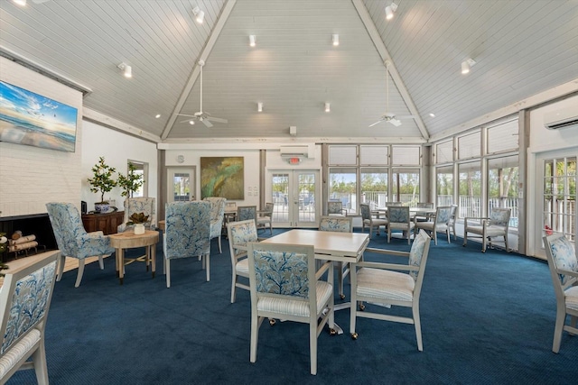 dining room featuring ceiling fan, dark carpet, high vaulted ceiling, and french doors