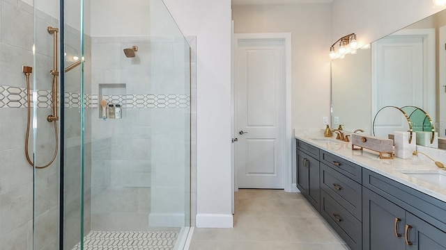 bathroom with tile patterned flooring, vanity, and a shower with shower door