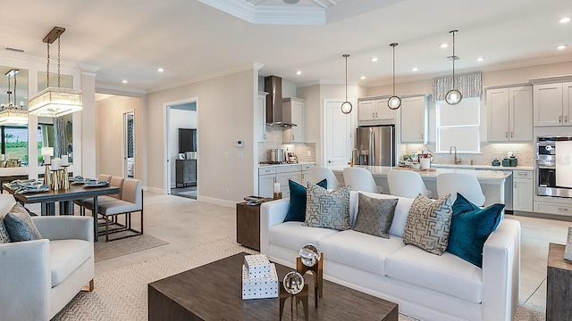 living room with sink and ornamental molding