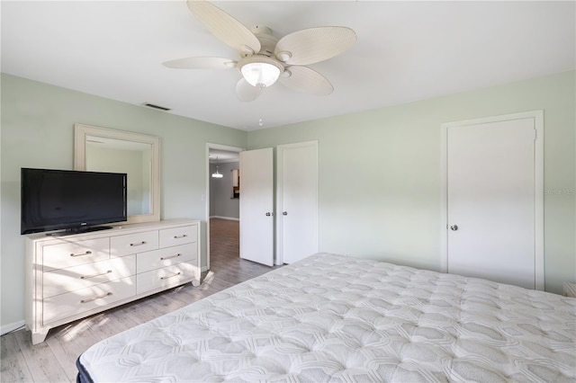 bedroom featuring light hardwood / wood-style flooring and ceiling fan