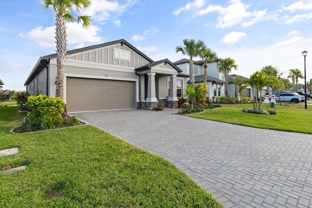 view of front of property with a garage and a front yard