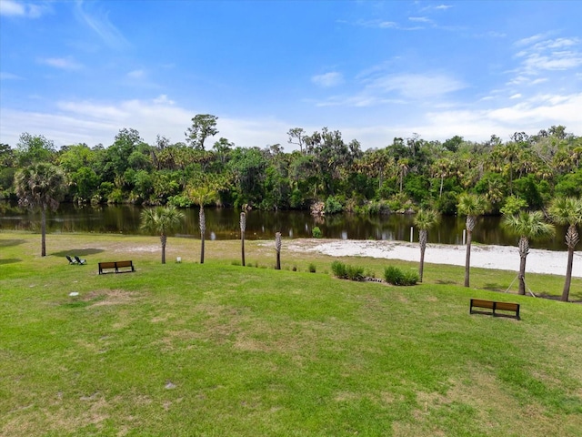 view of home's community featuring a yard and a water view