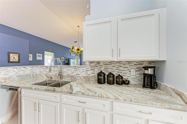 kitchen with white cabinetry, sink, and stainless steel dishwasher