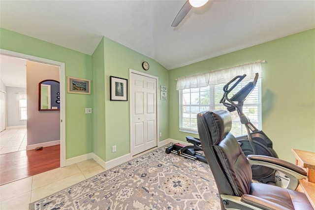 tiled home office with ceiling fan, lofted ceiling, and a wealth of natural light