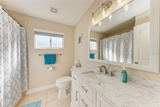 bathroom featuring tile patterned floors, vanity, and toilet