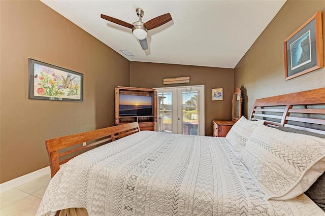 bedroom with ceiling fan, french doors, vaulted ceiling, access to outside, and light tile patterned floors