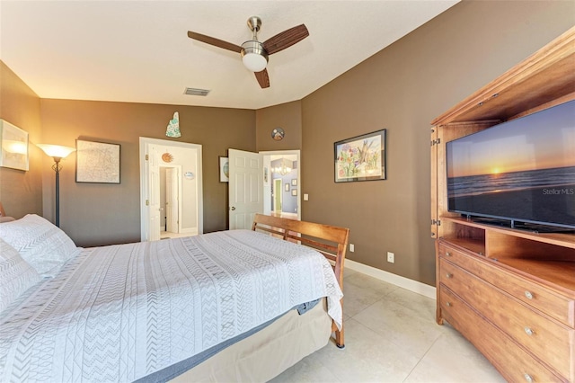 tiled bedroom with ceiling fan and lofted ceiling