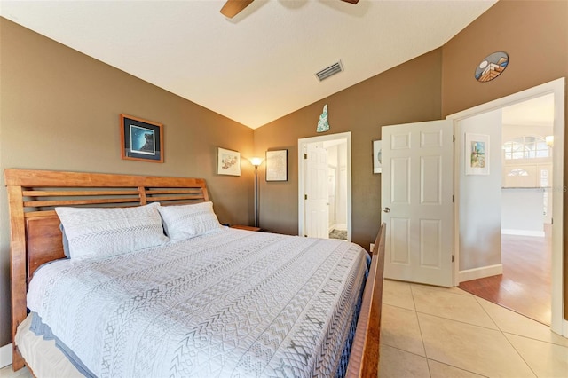 bedroom featuring light tile patterned floors, ceiling fan, and lofted ceiling