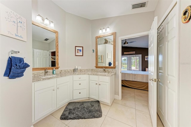 bathroom featuring tile patterned floors, french doors, vanity, and lofted ceiling