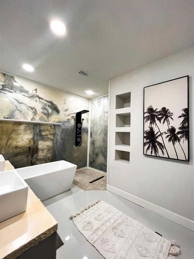 bathroom featuring built in shelves, vanity, and independent shower and bath