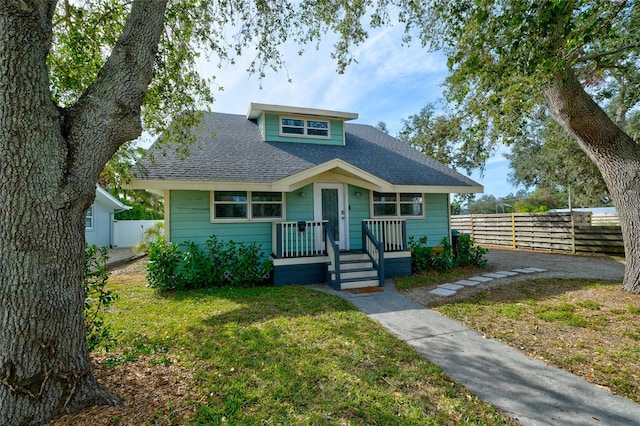 bungalow with a front yard