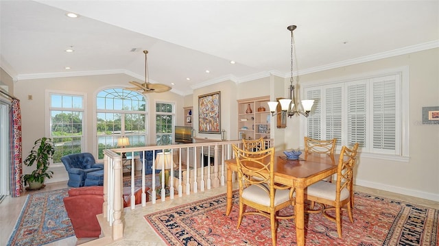 dining space featuring ceiling fan with notable chandelier, crown molding, and lofted ceiling