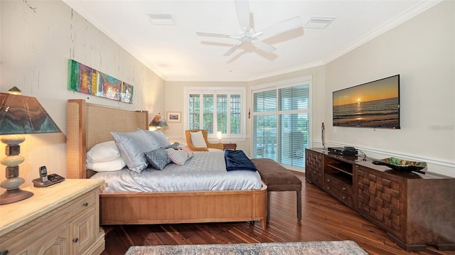 bedroom featuring dark hardwood / wood-style floors, ceiling fan, and crown molding