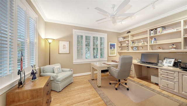 office space featuring rail lighting, light hardwood / wood-style floors, ceiling fan, and crown molding