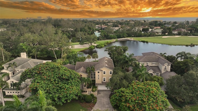 aerial view at dusk with a water view