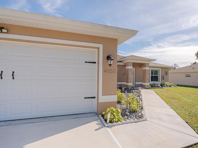 exterior space featuring a garage and a front lawn