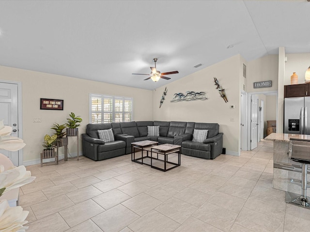 tiled living room featuring ceiling fan