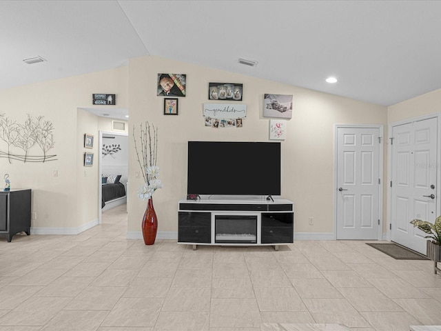 tiled living room featuring lofted ceiling