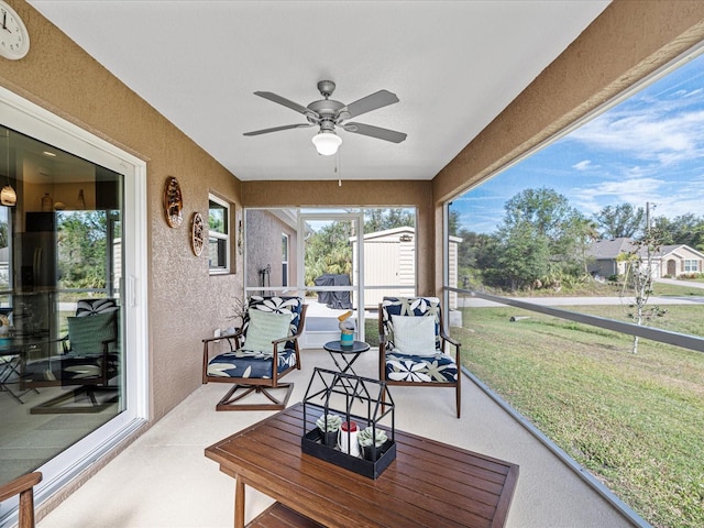 sunroom / solarium with ceiling fan