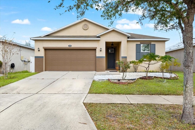 single story home featuring a garage and a front yard