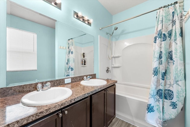 bathroom featuring shower / tub combo with curtain, vanity, and hardwood / wood-style flooring