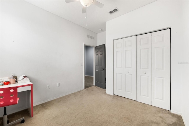 unfurnished bedroom featuring a closet, ceiling fan, and carpet flooring