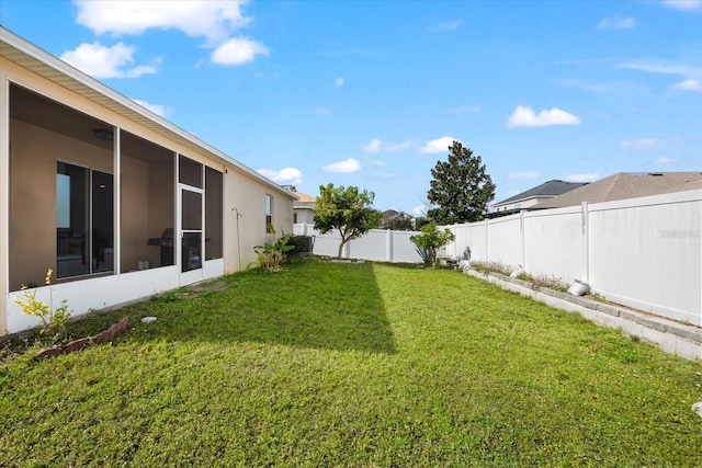 view of yard featuring a sunroom