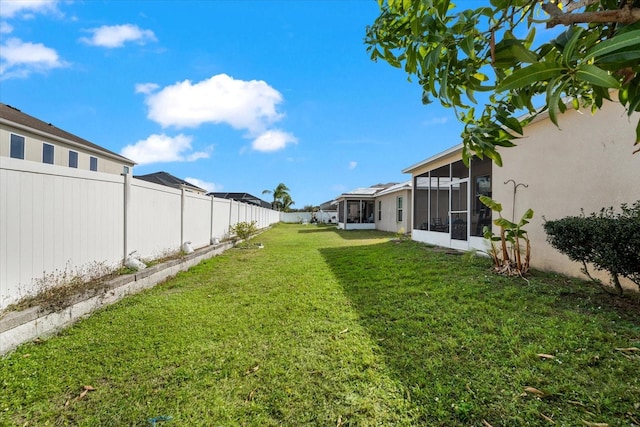 view of yard with a sunroom