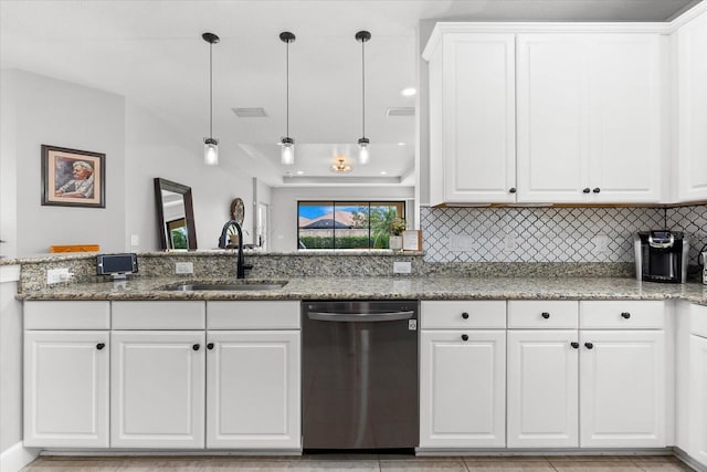 kitchen featuring pendant lighting, light stone countertops, white cabinetry, and stainless steel dishwasher