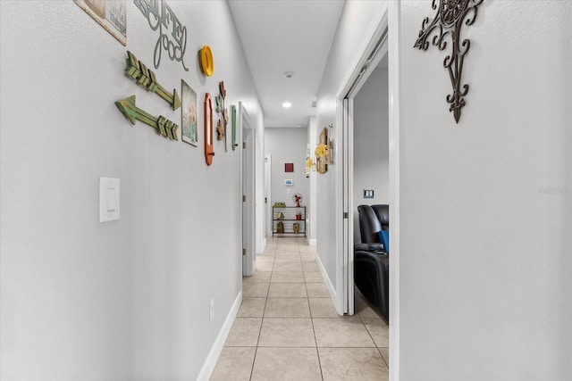 hall featuring light tile patterned floors