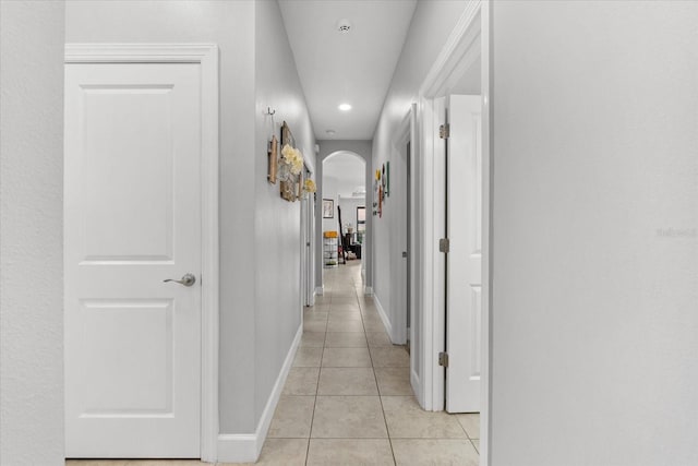 corridor with light tile patterned floors