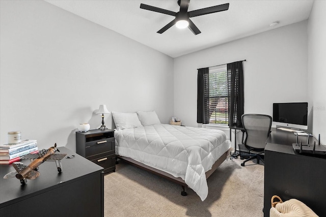 bedroom with ceiling fan and light colored carpet